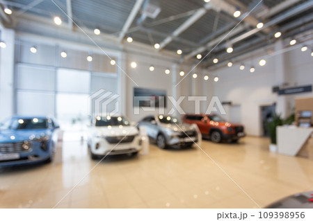 Blurred new car parked in modern showroom waiting for sales. Blurred new car parked in modern showroom waiting for sales. 109398956
