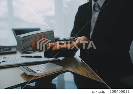 Salesman send key to customer after good deal agreement, successful car loan contract buying or selling new vehicle. Salesman send key to customer after good deal agreement, successful car loan contract buying or selling new vehicle. 109400031