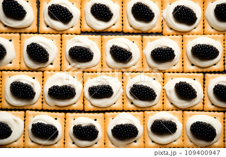Closeup of natural black caviar served on crackers on black background, texture of fresh sturgeon caviar macro photo. Closeup of natural black caviar served on crackers on black background, texture of fresh sturgeon caviar macro photo. 109400947