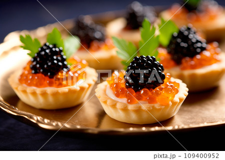 Closeup of natural black caviar served on crackers on black background, texture of fresh sturgeon caviar macro photo. 109400952