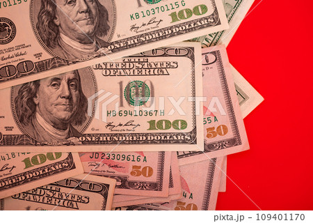 Dollars on a red background. Banks and financial concept. American currency, cash. 109401170