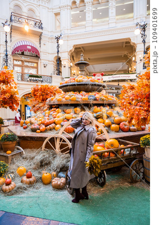 A beautiful blonde woman near the pumpkins A beautiful blonde woman near the pumpkins 109401699