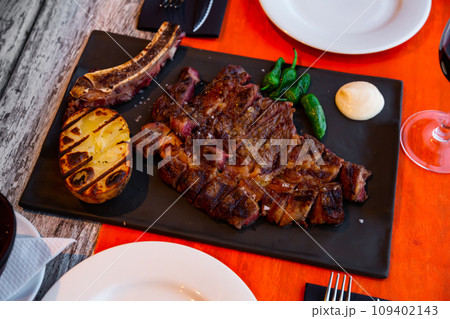 Tasty grilled beef with potato served Tasty grilled beef with potato served 109402143