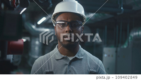 African American professional engineer looks at camera African American professional engineer looks at camera 109402849