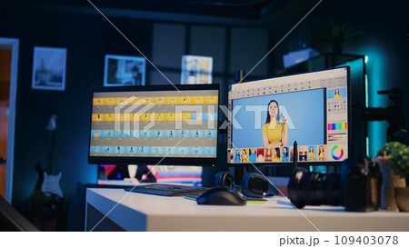 Empty media agency office with multi monitors setup used for post processing retouching of images. Editing software interface on computer screens in professional graphic design creative studio 109403078
