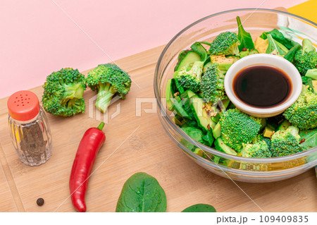 Fresh Green Salad of Avocado, Broccoli, Spinach and Cucumber Fresh Green Salad of Avocado, Broccoli, Spinach and Cucumber 109409835