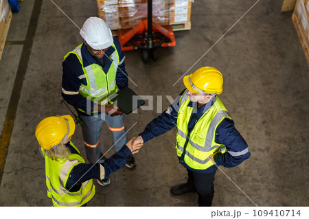 Diversity ethnicity of warehouse staff or engineer making a discussion together before start working, team of engineer in factory making a morning brief before working. 109410714