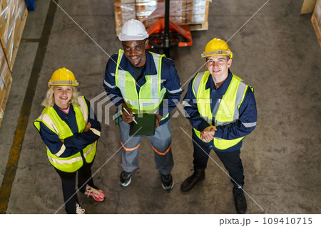 Diversity ethnicity of warehouse staff or engineer making a discussion together before start working, team of engineer in factory making a morning brief before working. Diversity ethnicity of warehouse staff or engineer making a discussion together before start working, team of engineer in factory making a morning brief before working. 109410715