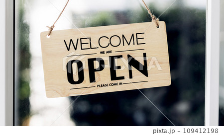 Open sign broad through the door glass and ready to service.  109412198