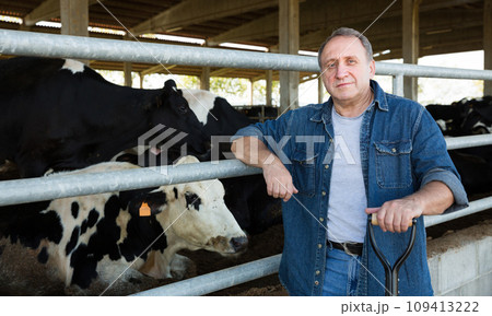 Confident man owner of dairy farm Confident man owner of dairy farm 109413222