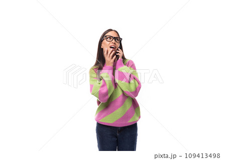 young beautiful caucasian woman with straight black hair with glasses is dressed in a stylish autumn 109413498