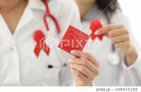 Nurse hold red lgbt symbol in her hand. 109415289
