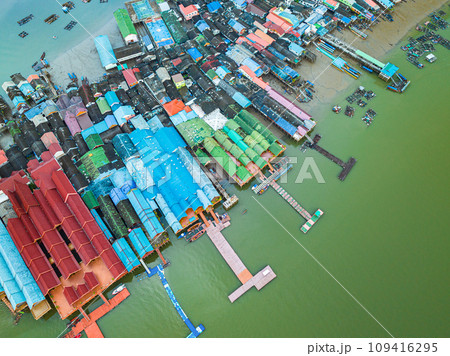 Aerial top view Colorful house roofs on a village on Koh Panyee. Aerial top view Colorful house roofs on a village on Koh Panyee. 109416295