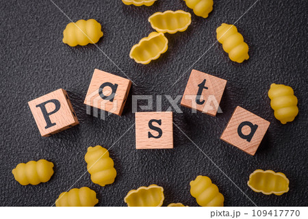 Raw durum wheat gnocchi pasta with salt and spices in a ceramic plate 109417770