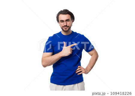 young brunette european man with a beard in a blue t-shirt is inspired by an idea on a white young brunette european man with a beard in a blue t-shirt is inspired by an idea on a white 109418226