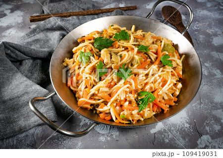 Fried noodles with chicken and vegetables. Fried noodles with chicken and vegetables. 109419031