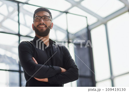 Portrait of smiling young businessman in office Portrait of smiling young businessman in office 109419130