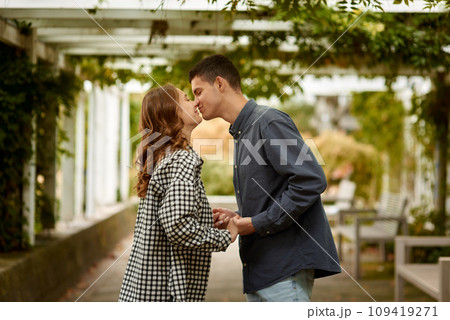Young Cute Female Hugs Boyfriend. In Autumn Outdoor. Lovers Walking in Park. Attractive Funny Couple. Lovestory in Forest. Man and Woman. Cute Lovers in the Park. Family Concept. Happy Couple. 109419271