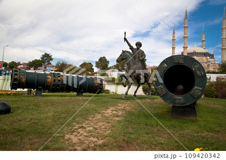 Statue of Mimar Sinan, who built the Selimiye Mosque in 1575, and big cannons, 09 August 2019 Turkey Edirne 109420342