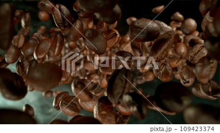 Freeze Motion of Falling Roasted Coffee Beans. Freeze Motion of Falling Roasted Coffee Beans. 109423374