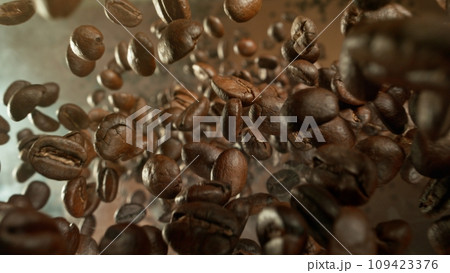 Freeze Motion of Falling Roasted Coffee Beans. Freeze Motion of Falling Roasted Coffee Beans. 109423376