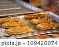 Closeup of Taiyaki Grilled Fish Cake with Cheese Filling - japanese food in the market, Vietnam 109426074