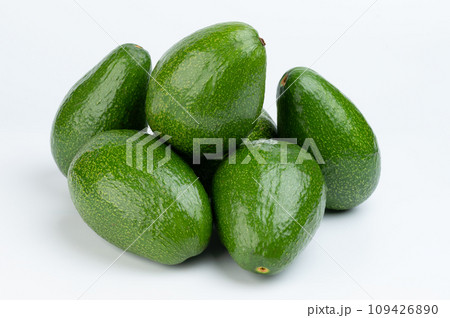 Pile of group green avocados 109426890