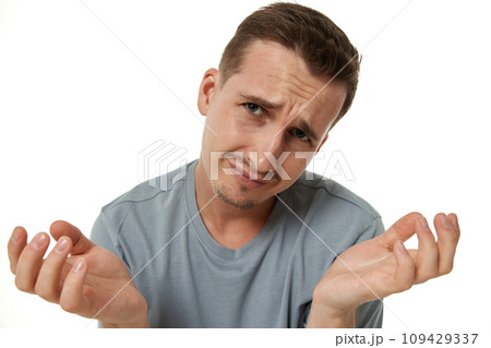 Portrait of offended frustrated young man on white background. Portrait of offended frustrated young man on white background. 109429337