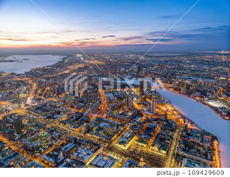 Embankment of the central pond and Plotinka in Yekaterinburg at winter sunset. The historic center of the city of Yekaterinburg, Russia, Aerial View Embankment of the central pond and Plotinka in Yekaterinburg at winter sunset. The historic center of the city of Yekaterinburg, Russia, Aerial View 109429609