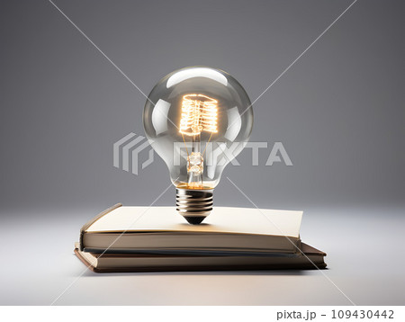 Light Bulb Resting on an Opened Book Positioned on a Desk.GenerativeAI. Light Bulb Resting on an Opened Book Positioned on a Desk.GenerativeAI. 109430442