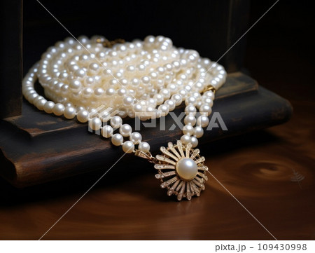 white pearl necklace on display, white pearl necklace on display, 109430998