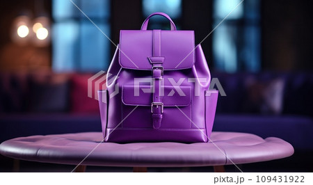 a purple backpack is sitting on a table, 109431922