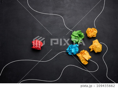 Crumpled paper balls on a black background, a group united against one Crumpled paper balls on a black background, a group united against one 109435662