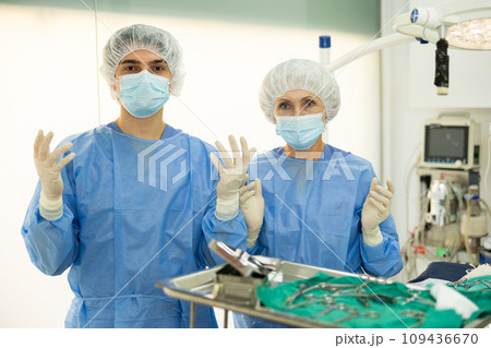 Professional veterinarians ready to conduct surgical operation at veterinary clinic 109436670
