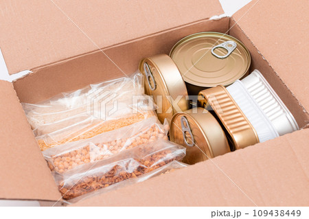 Carton Box with Canned Food, Cereals and Grocery - Donation Box or Food Reserves Carton Box with Canned Food, Cereals and Grocery - Donation Box or Food Reserves 109438449