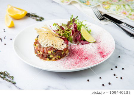 meat salad with arugula and lime, side view meat salad with arugula and lime, side view 109440182