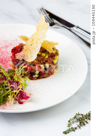 meat salad with arugula and lime, side view meat salad with arugula and lime, side view 109440190