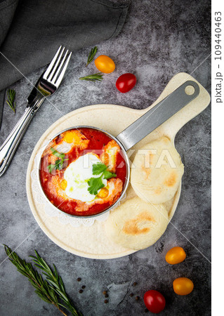borscht in a frying pan with fresh flatbreads and cherry tomatoes top view borscht in a frying pan with fresh flatbreads and cherry tomatoes top view 109440463