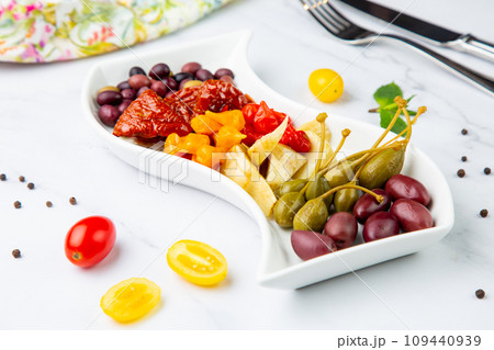 assorted nuts and dried vegetables on a light background side view 109440939