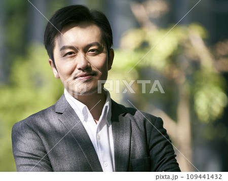 outdoor portrait of an asian business man outdoor portrait of an asian business man 109441432