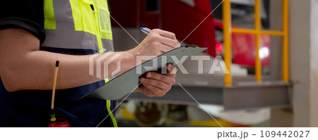 Closeup hands of engineer man or worker checking electric train for planning maintenance. Closeup hands of engineer man or worker checking electric train for planning maintenance. 109442027