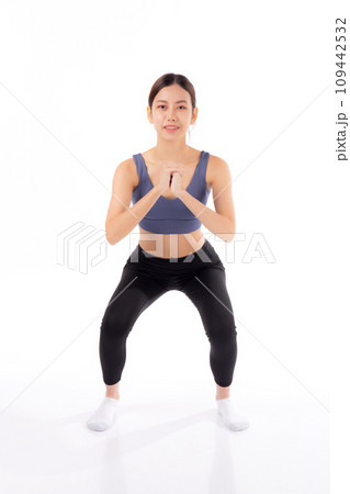 Full length portrait beautiful young asian woman in sportswear practicing doing squats. Full length portrait beautiful young asian woman in sportswear practicing doing squats. 109442532