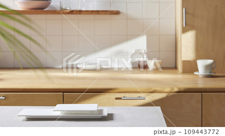 A sunny kitchen with white tile walls, a wooden table and sink. A sunny kitchen with white tile walls, a wooden table and sink. 109443772