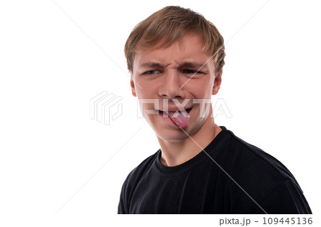 Blond teenager boy makes a grimace 109445136