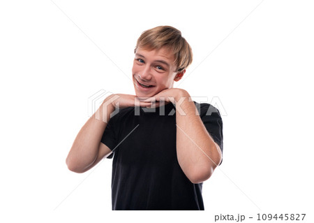 Portrait of a cute teenage guy with blond hair on a white background Portrait of a cute teenage guy with blond hair on a white background 109445827