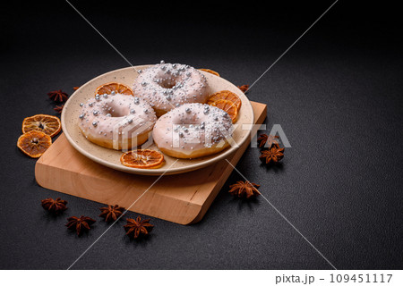 Delicious fresh donut of white or beige color with silver beads and cream 109451117