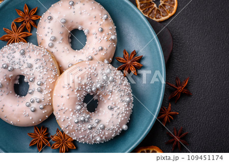 Delicious fresh donut of white or beige color with silver beads and cream 109451174