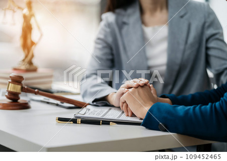 Legal advisers encourage clients. Justice and lawyer concept in the office. Legal advisers encourage clients. Justice and lawyer concept in the office. 109452465
