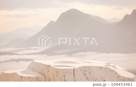 AI-generated content. marble stone rock, podium for product placement against mountain background. Stone platform in front of mountain panorama. 109453461
