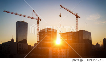 Construction site with tower crane. Construction of residential buildings. Panoramic view of construction of skyscrapers. 109454249